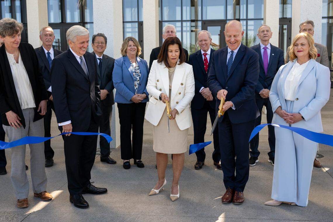 Retired California Supreme Court Chief Justice Tani G. Cantil-Sakauye and Sacramento County Presiding Judge Lawrence G. Brown cut the ribbon as the California Judicial Branch dedicates the new Tani G. Cantil-Sakauye Courthouse in Sacramento on Friday.