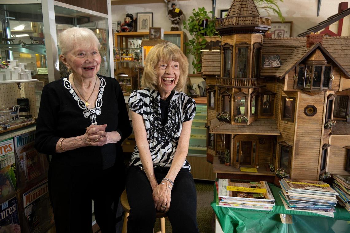 Sisters Barbara Taplin, 90, and Linda Vertrees, 81, stand inside of their store, The Elegant Dollhouse, in Arden Arcade on Thursday, Aug. 25, 2022. Taplin has owned the store for over 40 years and her sister moved from Southern California to help her run the store.