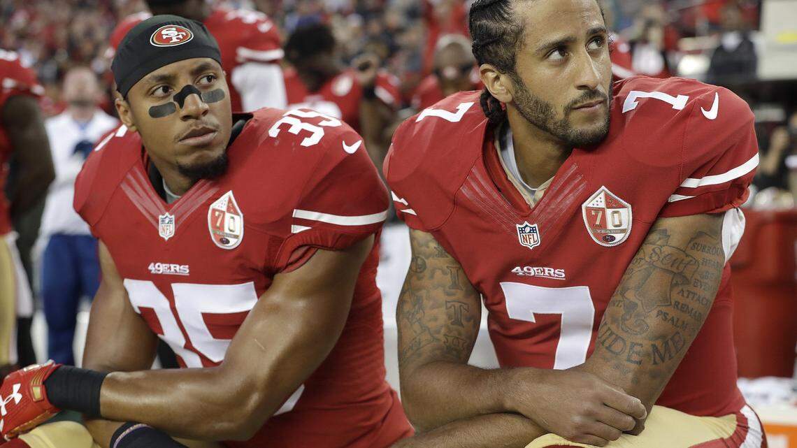 San Francisco 49ers safety Eric Reid and quarterback Colin Kaepernick kneel during the national anthem before an NFL football game against the Los Angeles Rams in 2016.
