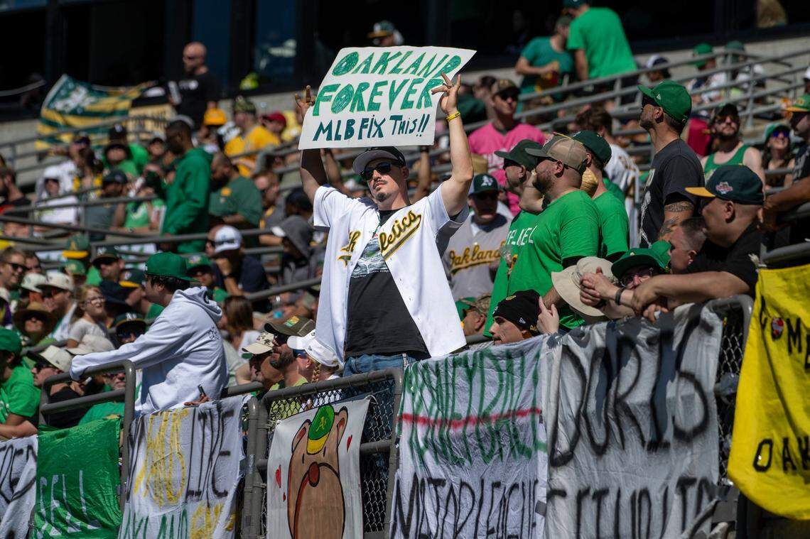 “Oakland forever” reads a fan’s sign before the Athletics played the Texas Rangers in the A’s final baseball game at Oakland-Alameda County Coliseum on Thursday.