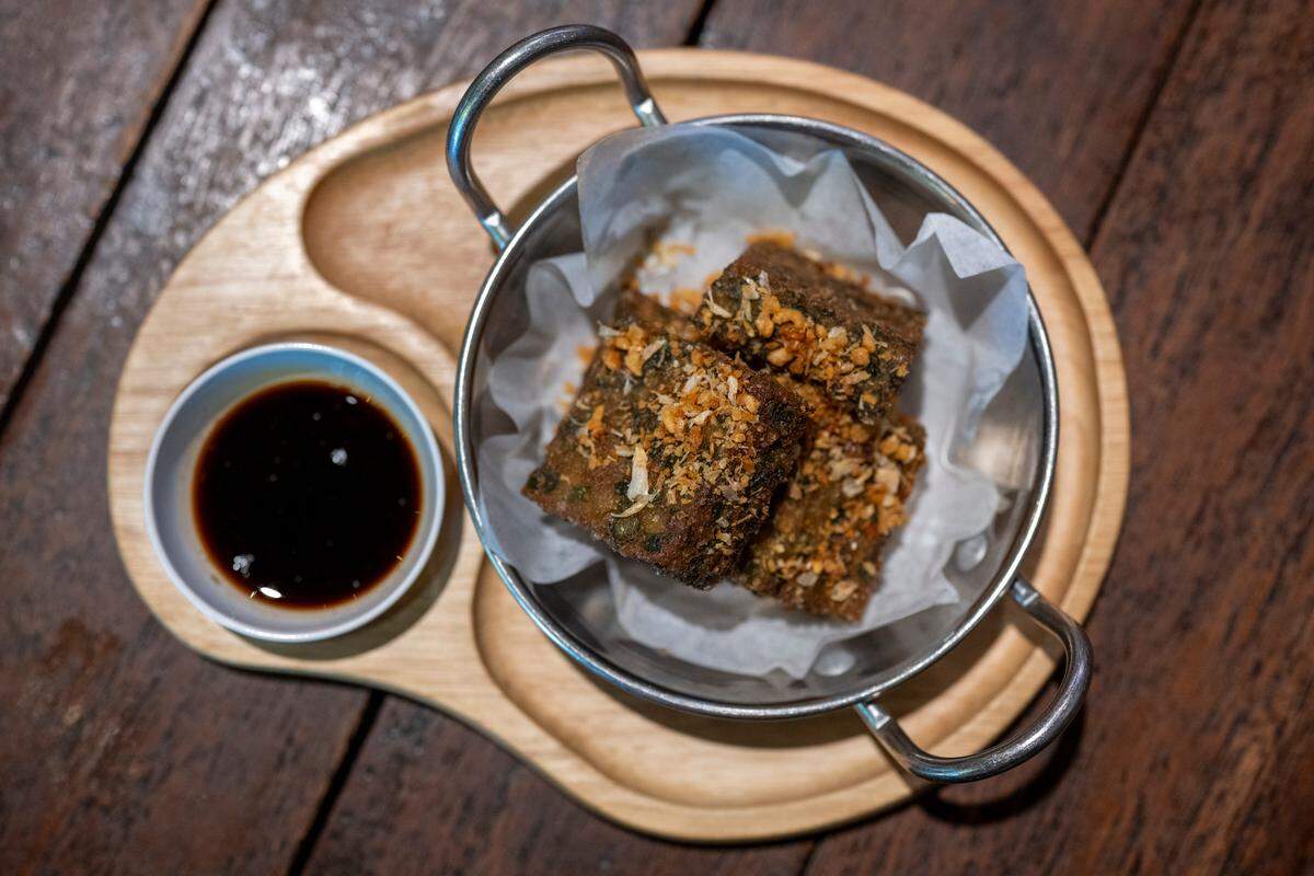 Chive Cakes sit on a plate in Kin Thai Street Eatery.