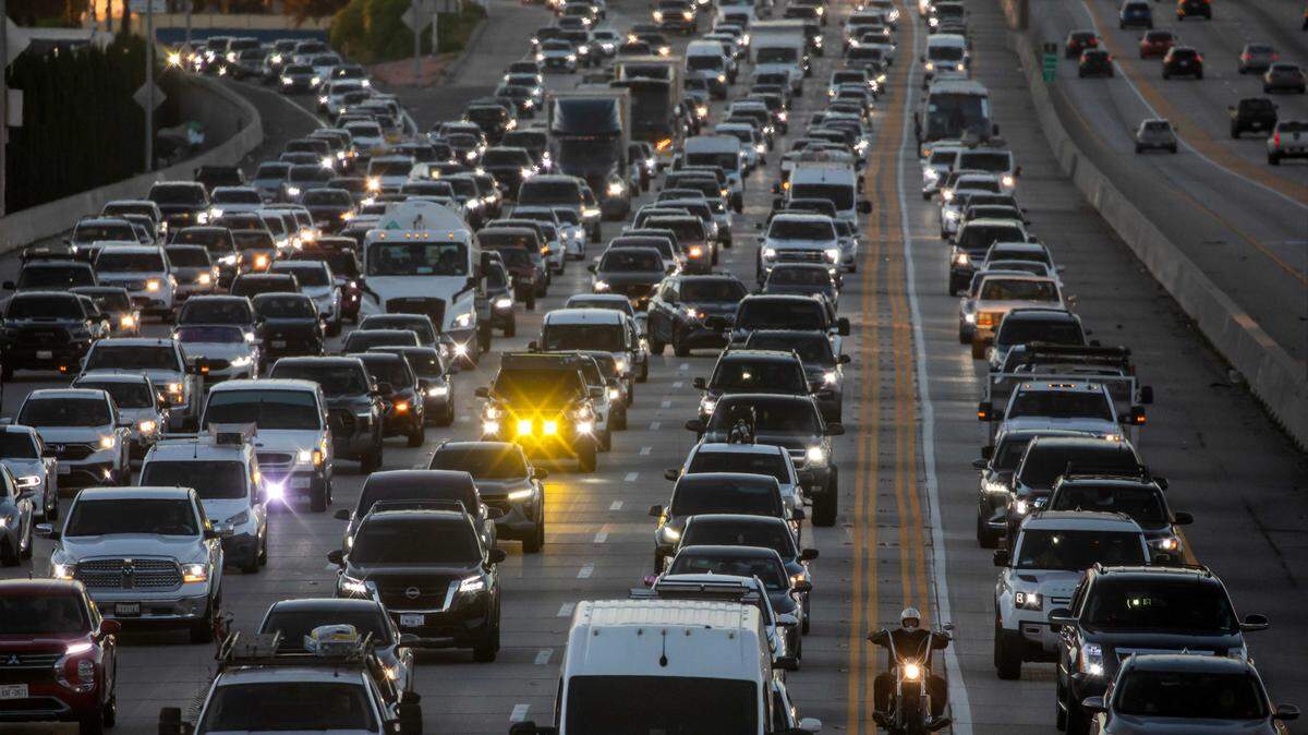Traffic moves along the San Diego Freeway on Friday in west Los Angeles. The U.S. Department of Justice filed a lawsuit Thursday in Sacramento federal court challenging California’s greenhouse gas emissions and zero-emission vehicle regulations, marking the latest effort by the Trump administration to roll back the state’s vehicle standards.