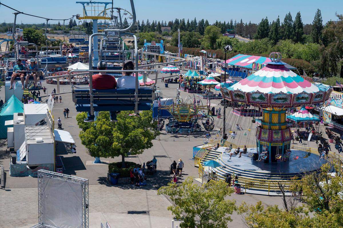 Guests enjoy the view from the Sky Ride at the California State Fair on Sunday, July 17, 2022, at Cal Expo.