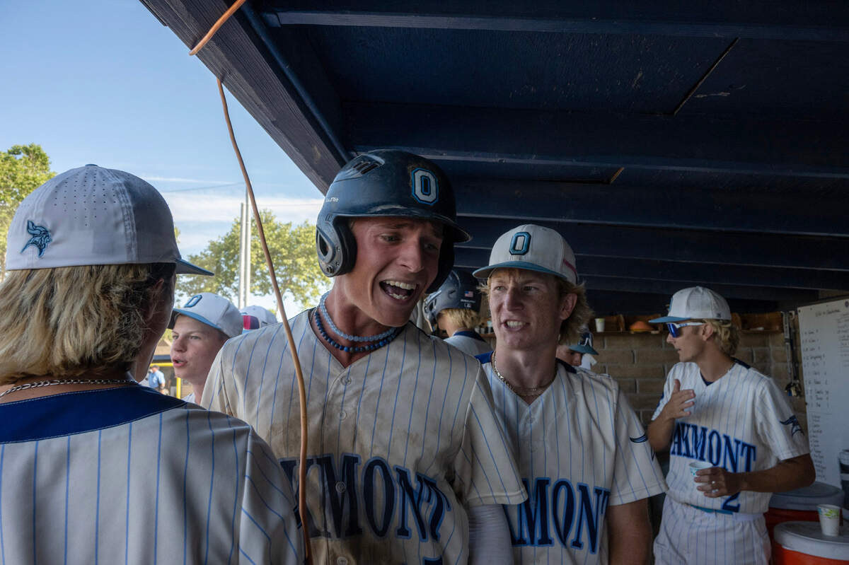 Oakmont baserunner Cooper Kunis, center, celebrates with teammates after scoring a run in the CIF NorCal Baseball Championship Division lll semfinal on Thursday in Roseville.