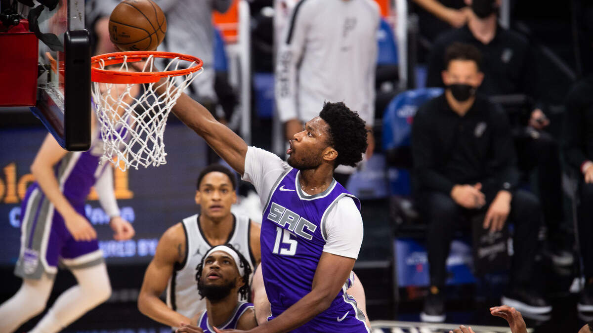 Sacramento Kings center Damian Jones (15) scores on a layup against the San Antonio Spurs during the second period of the NBA game Friday, May 7, 2021, at Golden 1 Center in downtown Sacramento.