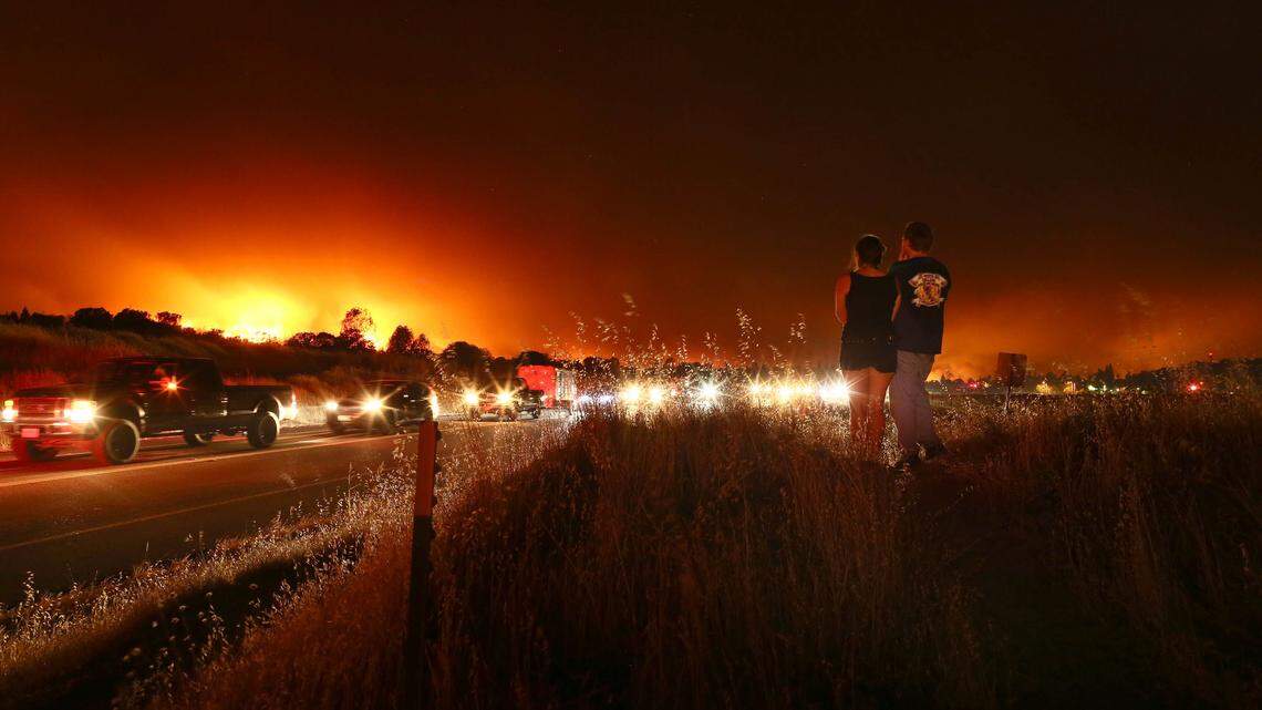 A long line of vehicles evacuate Redding as the Carr Fire approaches in July 2018. More than 1,000 homes were destroyed, but no residents died.