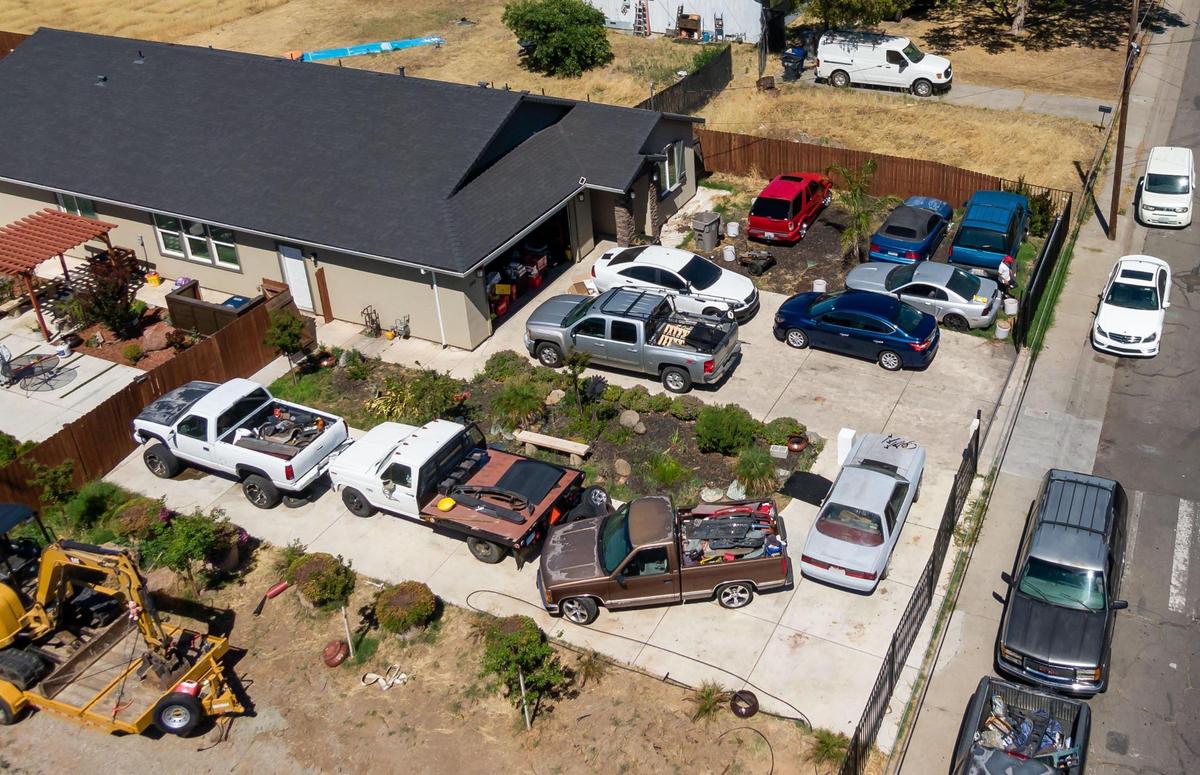 The house Sacramento City Councilman Sean Loloee owns, and has used as his home address to vote, is seen with several vehicles on the property Thursday in the Hagginwood neighborhood of Sacramento.