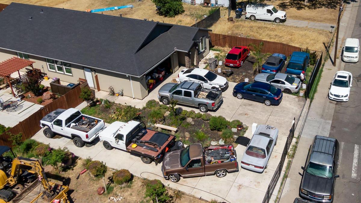 The house Sacramento City Councilman Sean Loloee owns, and has used as his home address to vote, is seen with several vehicles on the property Thursday in the Hagginwood neighborhood of Sacramento.