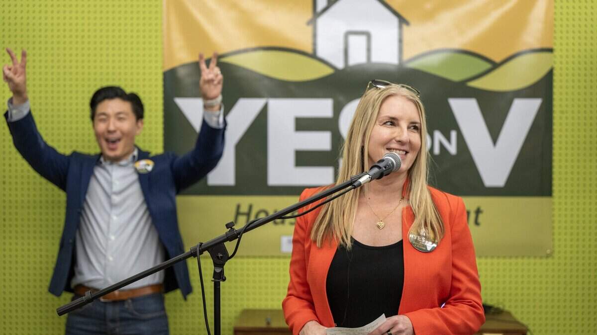 Rochelle Swanson and Andrew Kim address the crowd at the Yes on V kick-off rally in Davis on Wednesday, March 4, 2026. The measure is trailing with about half of votes counted, according to preliminary results.