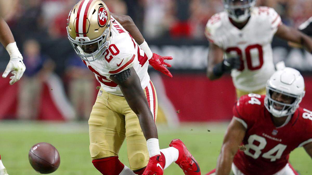 Cornerback Jimmie Ward (20) of the 49ers chases a fumble by Arizona Cardinals tight end Jermaine Gresham (84) in the second half of Sunday’s game in Glendale, Ariz. Teams are asking about Ward as the trade deadline approaches Tuesday.