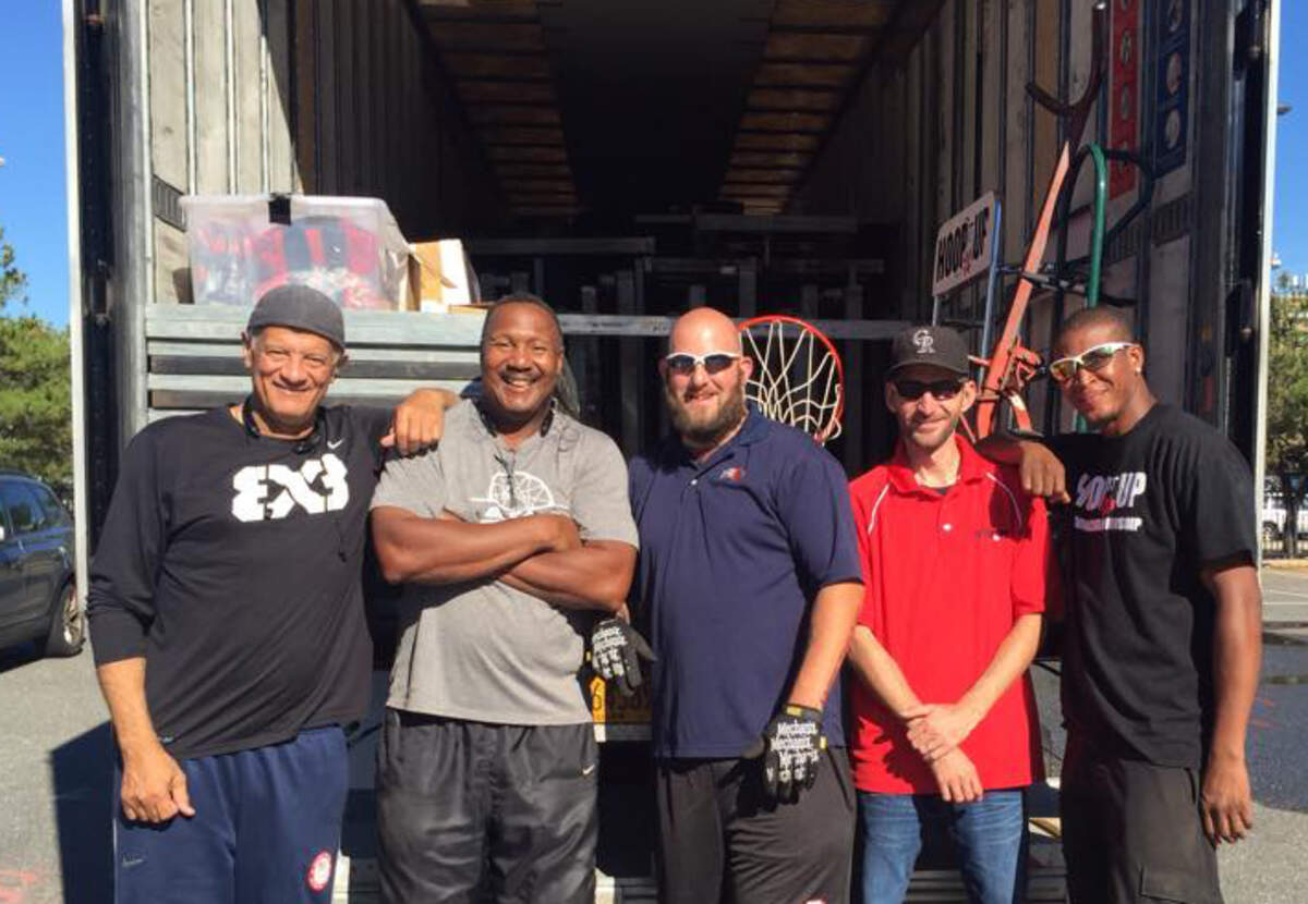 Kim Dennis, far left, poses with the crew after a Hoop It Up tournament in Florida.