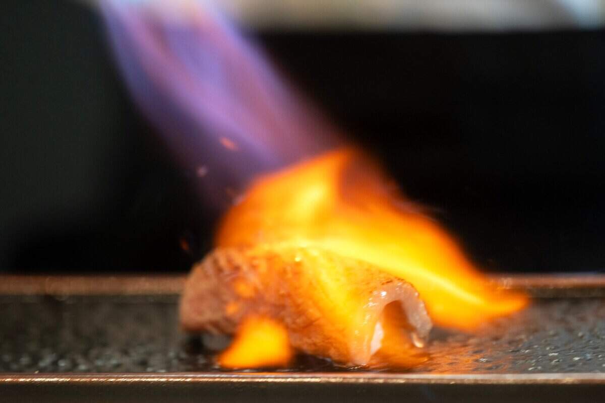 Chef Frank Zhu prepares wagyu at Chef Frank Japanese Cuisine in North Natomas last month.