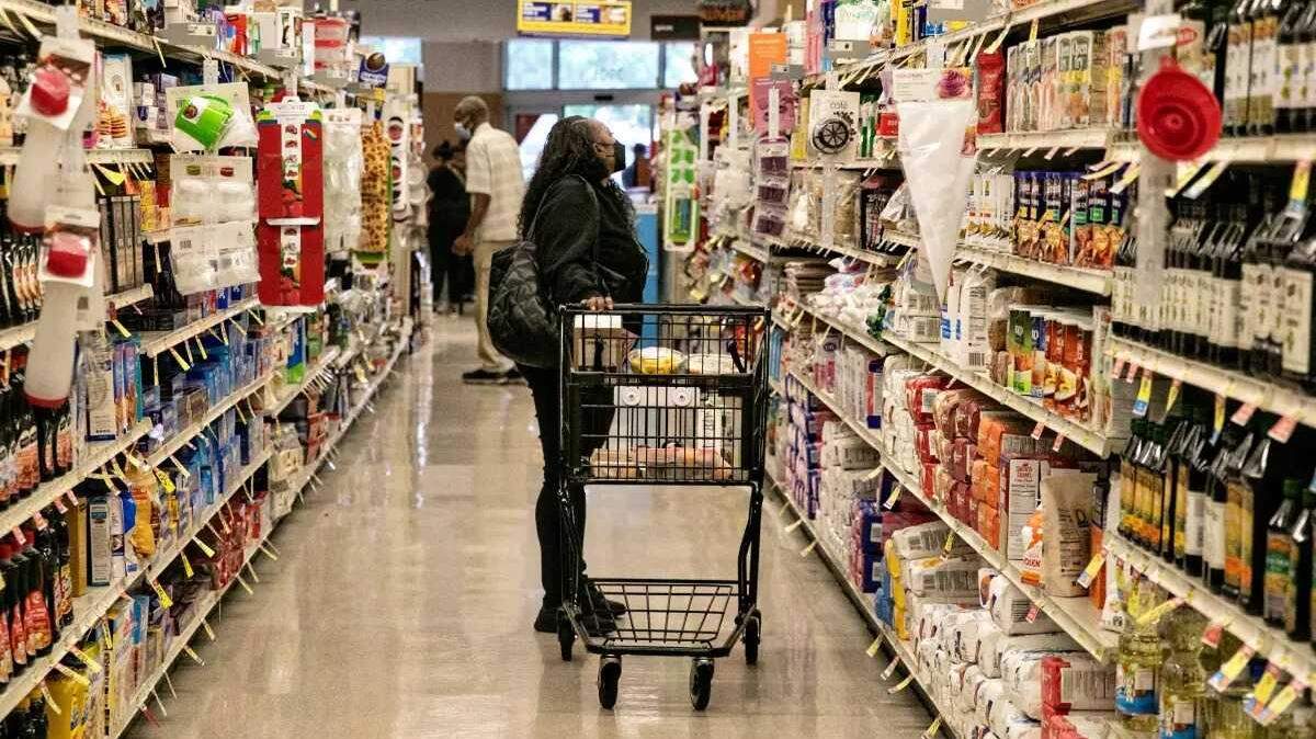 A shopper visits Albertsons in Los Angeles earlier this year.