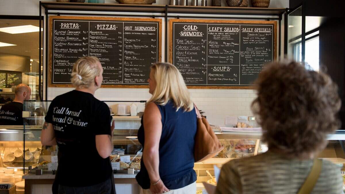Customers look at menu board at OBO’ Italian Table & Bar in 2016.