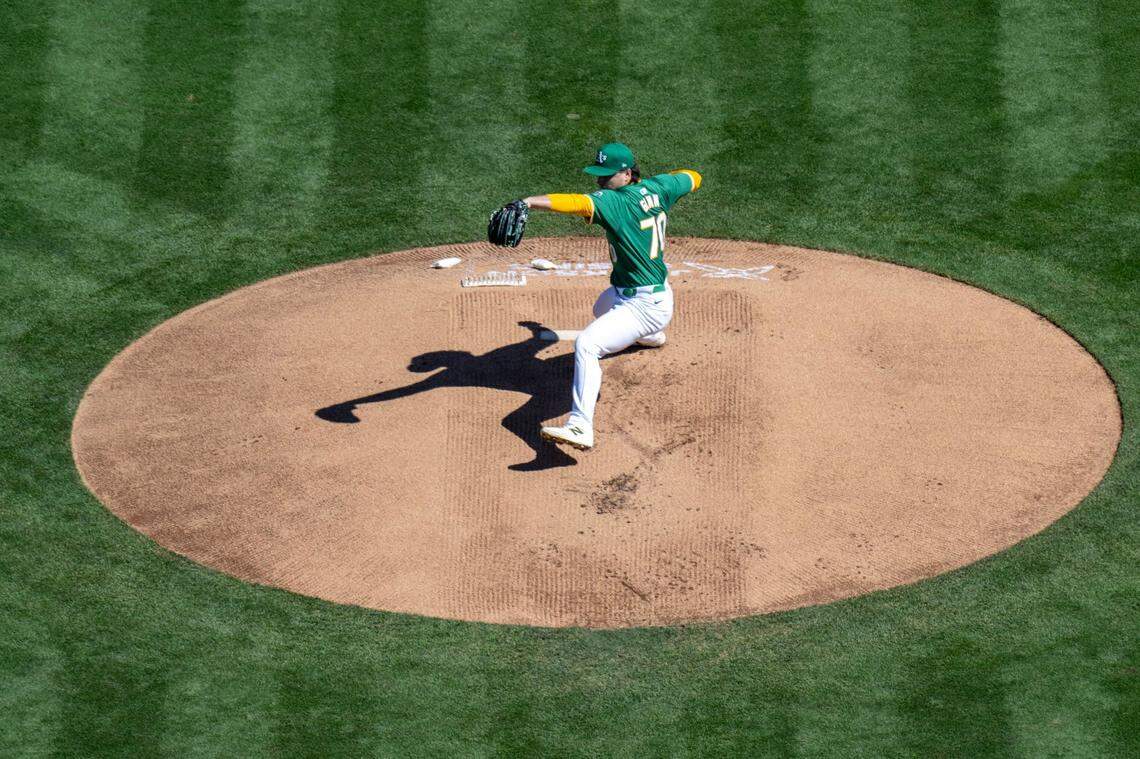 The Oakland A’s starting pitcher J.T. Ginn pitches to the Texas Rangers in the team’s final game at Oakland-Alameda County Coliseum on Thursday.