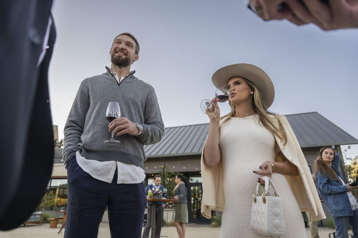Sacramento Kings center Domantas Sabonis and wife Shashana sip red wine during the private unveiling of new vintages from their Ones family wine brand on Saturday in Napa Valley. 