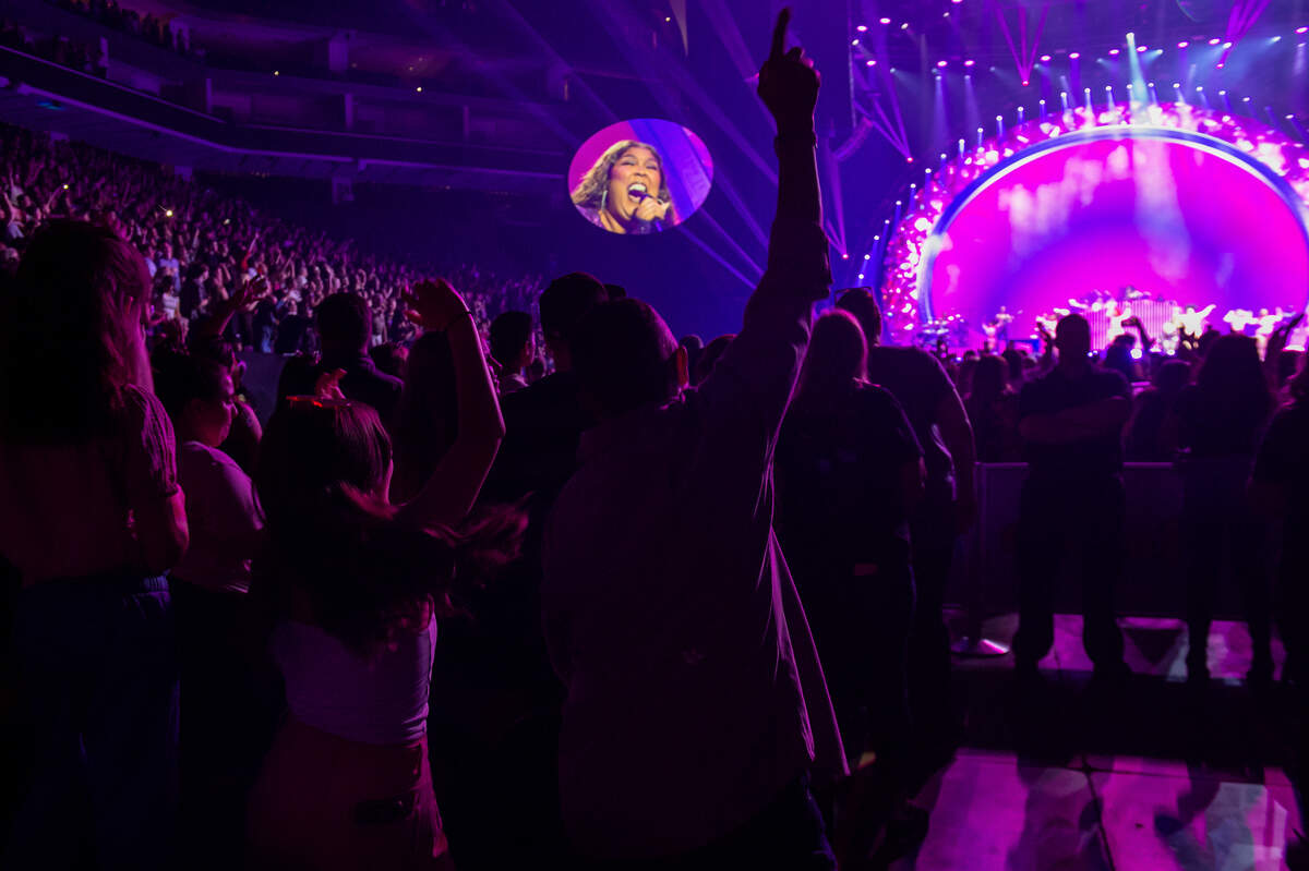 Chase Rivera, center, dances with his niece Ashley, 11, left, as Lizzo sings “2 Be Loved” on The Special 2our at Golden 1 Center on Sunday, May 28, 2023.