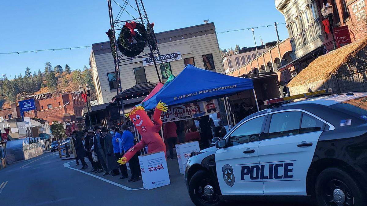 The Placerville Police Department hosts A Toys for Tots drive on Saturday, Dec. 5. The event was crashed hours later by a group wearing Proud Boys attire who flashed hate signs and posed for photos, videos posted online show.