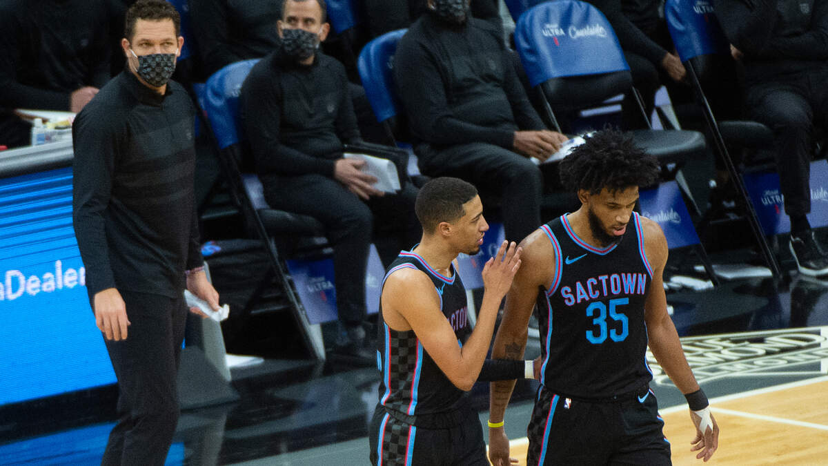 Sacramento Kings guard Tyrese Haliburton (0) taels with Sacramento Kings forward Marvin Bagley III (35) during a time-out in the third quarter during a game at Golden 1 Center on Friday, Jan. 22, 2021 in Sacramento.