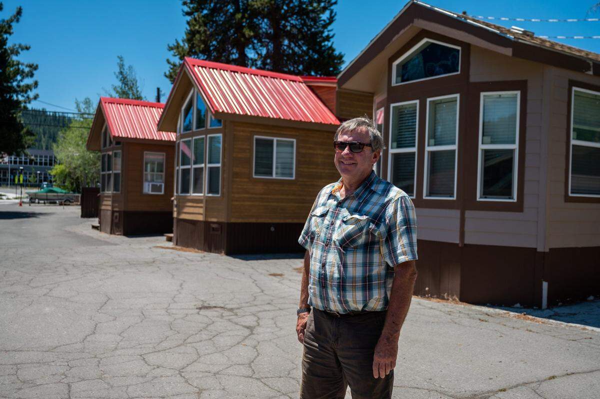 Dave Wilderotter, owner of Owner of Tahoe Dave's, stands in front of several tiny homes in Truckee on Tuesday, July 13, 2021. Wilderotter built a tiny home village so area workers could have housing in the greater Tahoe region.