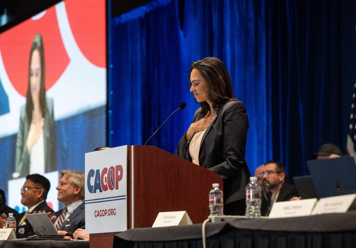 Corrin Rankin holds her hand over her heart as she speaks at the CAGOP spring organizing convention in Sacramento after being voted the new California Republican Party chairwoman Sunday.