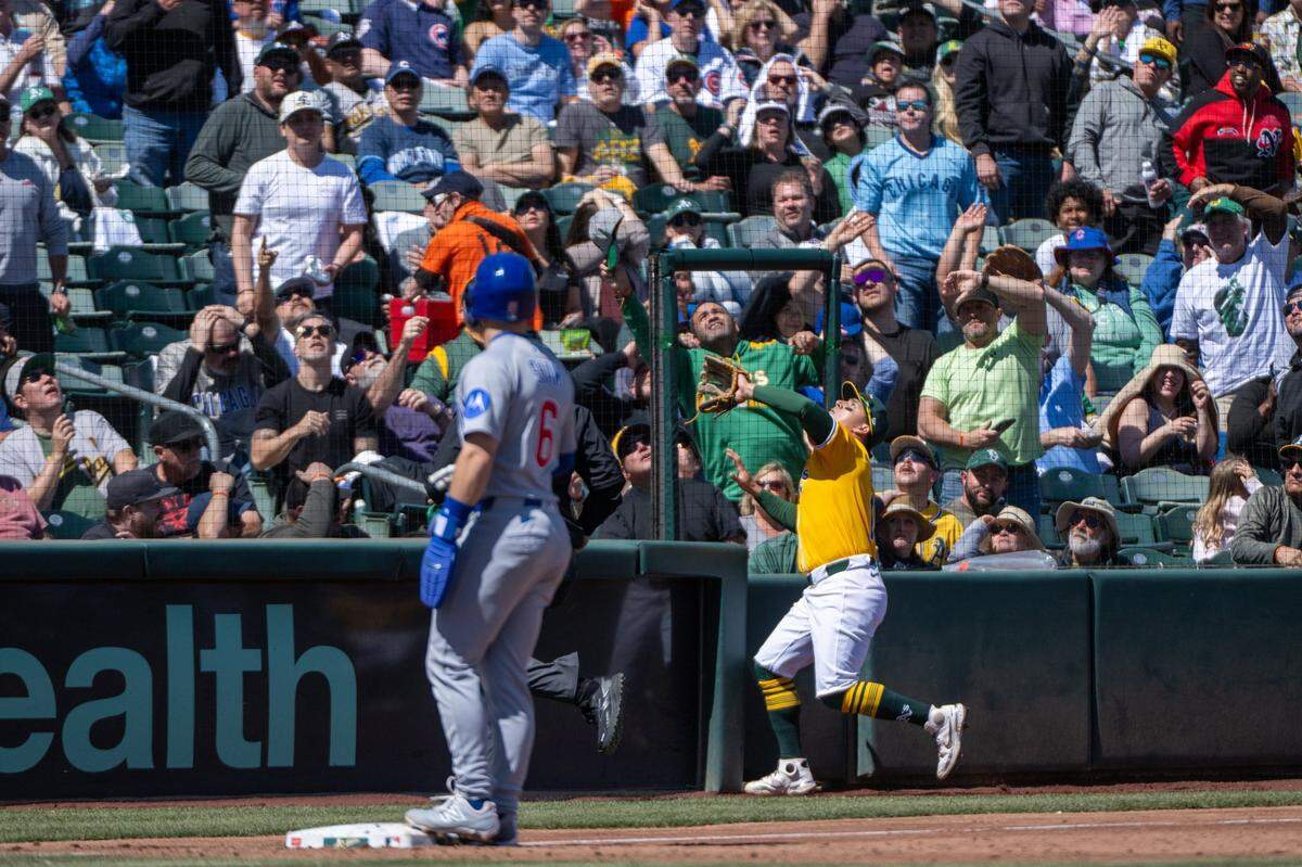 The Athletics’ Luis Urias chases a foul ball hit by Chicago Cubs outfielder Ian Happ (8) in the third inning on Wednesday, April 2, 2025, during the A’s first day game at Sutter Health Park in West Sacramento.