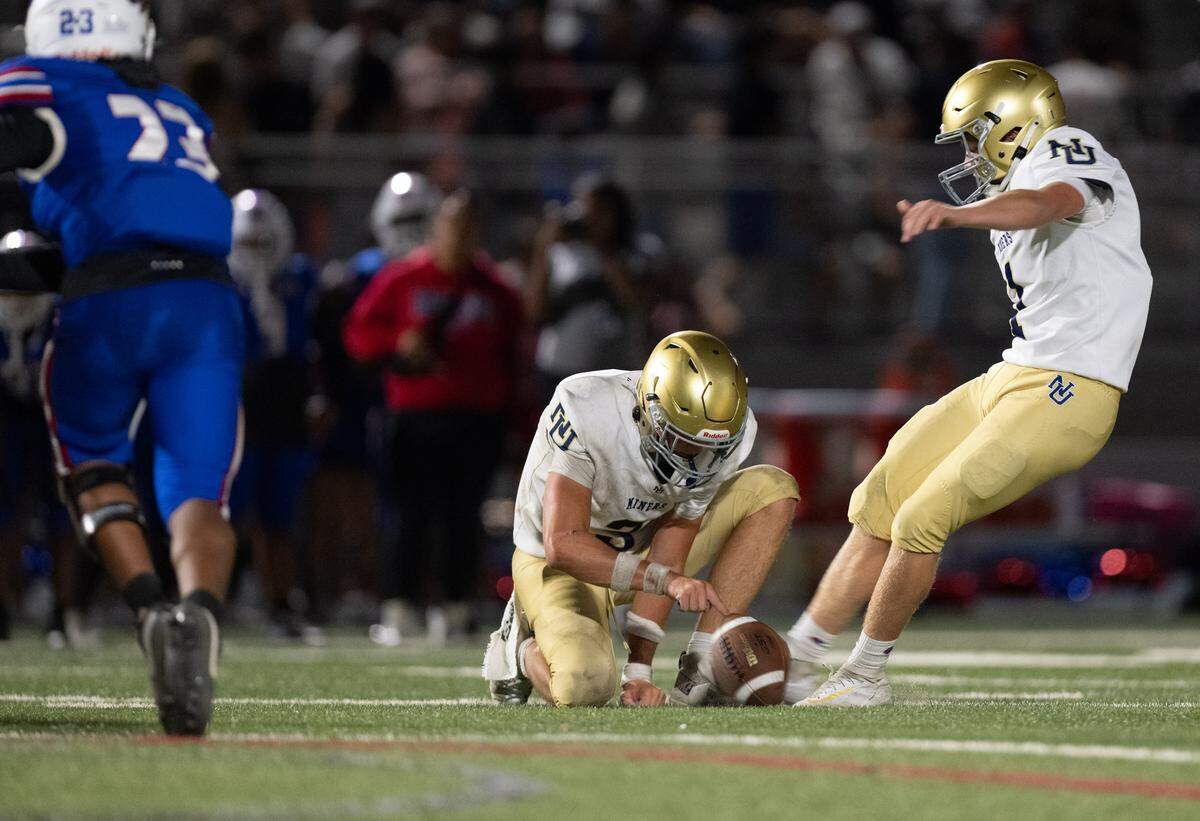 The Nevada Union Miners' Aonghas Wright (1) kicks a field goal to end the first half against Christian Brothers Falcons in Sacramento on Friday.