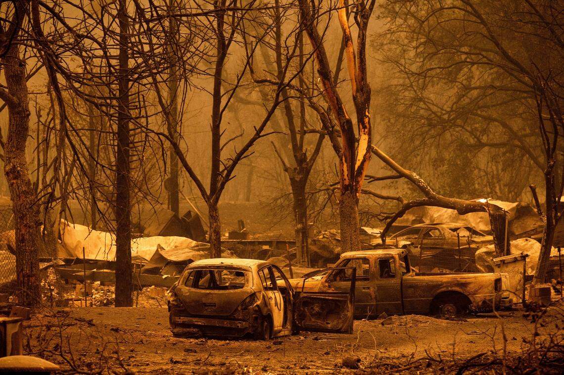 Scorched vehicles and residences line the Oaks Mobile Home Park in the Klamath River community as the McKinney Fire burns in Klamath National Forest on Saturday.