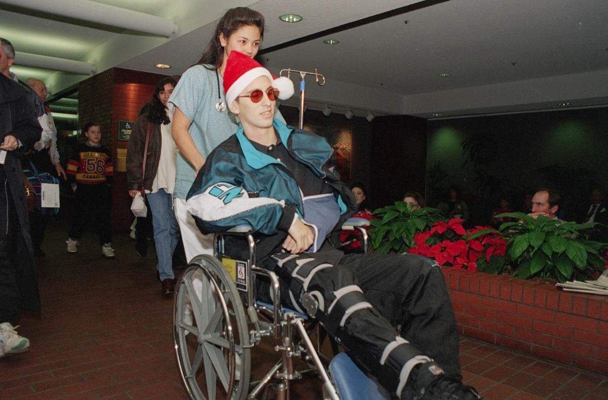 The Sacramento Kings’ Bobby Hurley is wheeled out the door by nurse Allison Darwin at the UC Davis Medical Center in Sacramento on Friday, Dec. 24, 1993, twelve days after being critically injured in an automobile accident.