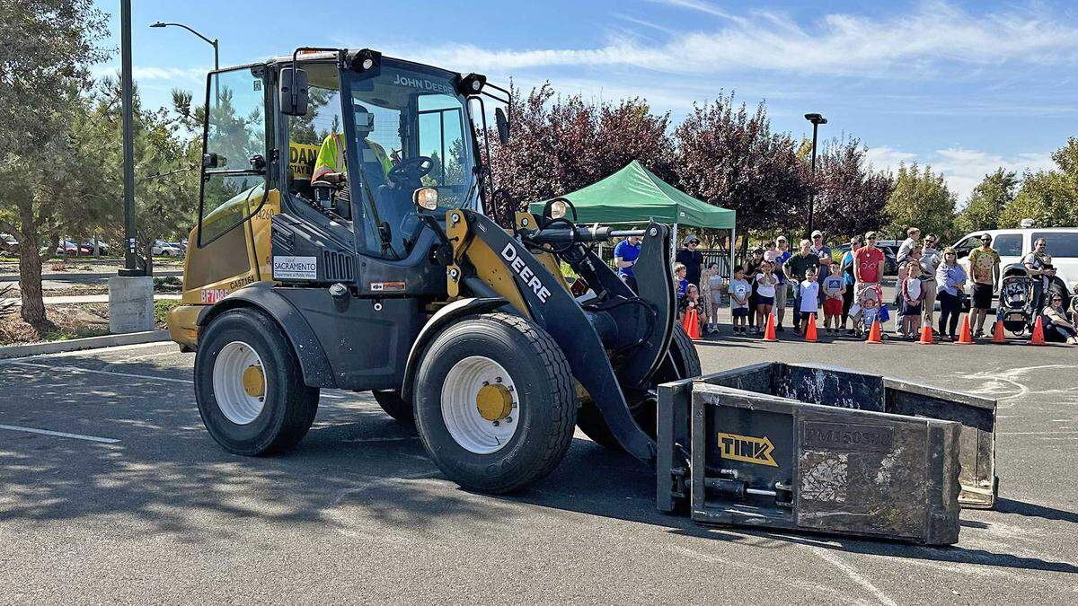 The Claw, a front-loading tractor fitted with an articulating bucket for picking up loose debris, is demonstrated to the public at North Natomas Regional Park on Saturday, Oct. 21, 2023. The implement, operated by the city of Sacramento’s Public Works Department, is deployed during the fall and winter months to pick up leaf piles across the city.