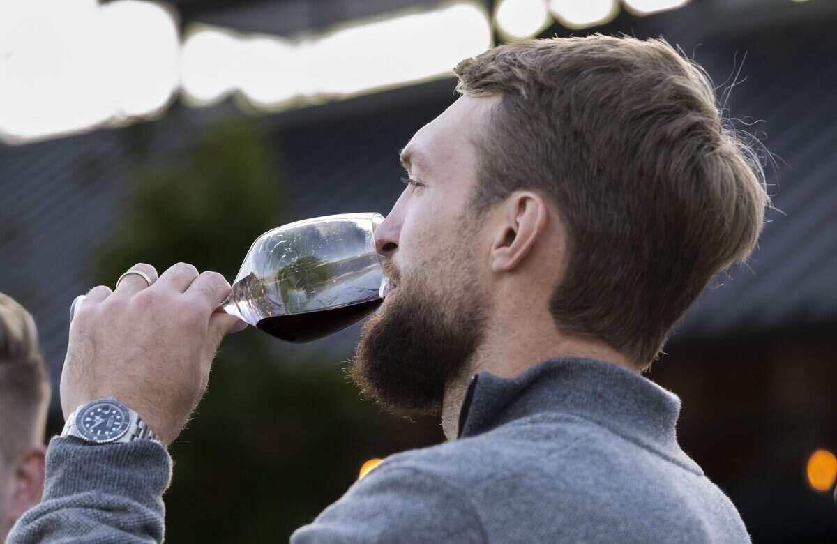 Sacramento Kings center Domantas Sabonis takes a sip of his family's Ones 2024 Pinot Noir on Saturday during a private unveiling of the vintage in Napa Valley. 