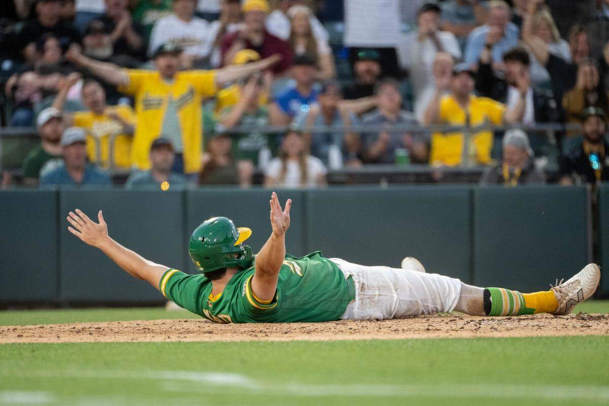 Athletics first baseman Nick Kurtz (16) reacts Wednesday at Sutter Health Park after he thought he scored in the fourth inning, but he was ruled out after a review of the play.