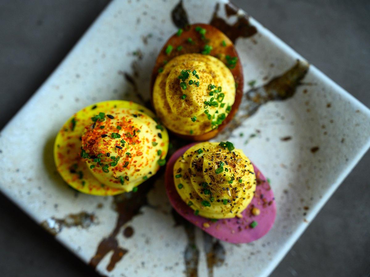 Tiger’s deviled eggs are prettily pickled in different colors.