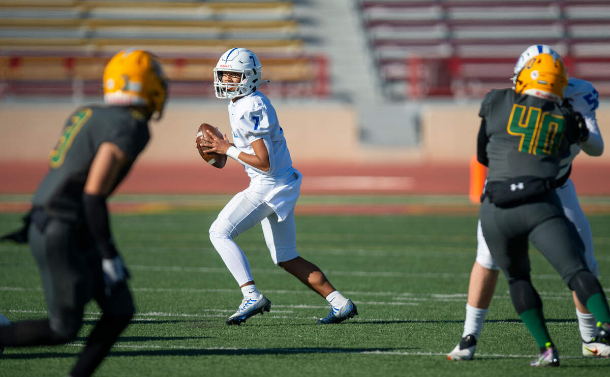 Capital Christian quarterback Eddie Brusuelas (7) steps back to pass against Vanden during the first half of the CIF Sac-Joaquin Section Division IV championship football game at Hughes Stadium in 2022.