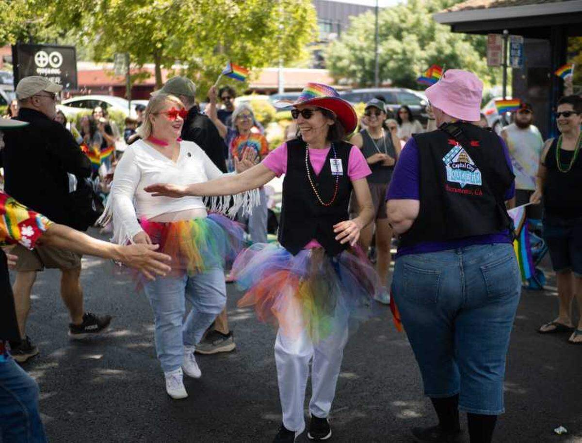 Members of Capital City Squares dance during the 2025 Sacramento Pride Parade. The all LGBTQ+ dance group has over 100 members, according to Nolan Neikirk, the club’s president.
