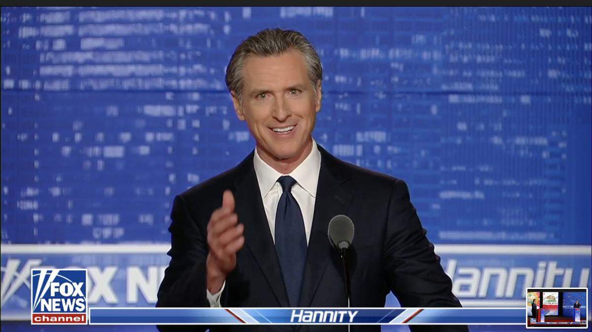 California Gov. Gavin Newsom, a Democrat, debates Florida Gov. Ron DeSantis, a Republican, in a Fox News debatę moderated by Sean Hannity on Thursday, Nov. 30, 2023.