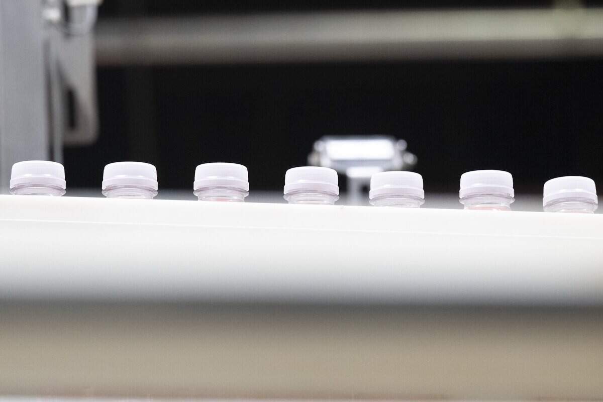 Sports drink bottles sit on the production line in the Redwood Beverage Group plant in West Sacramento on Thursday.