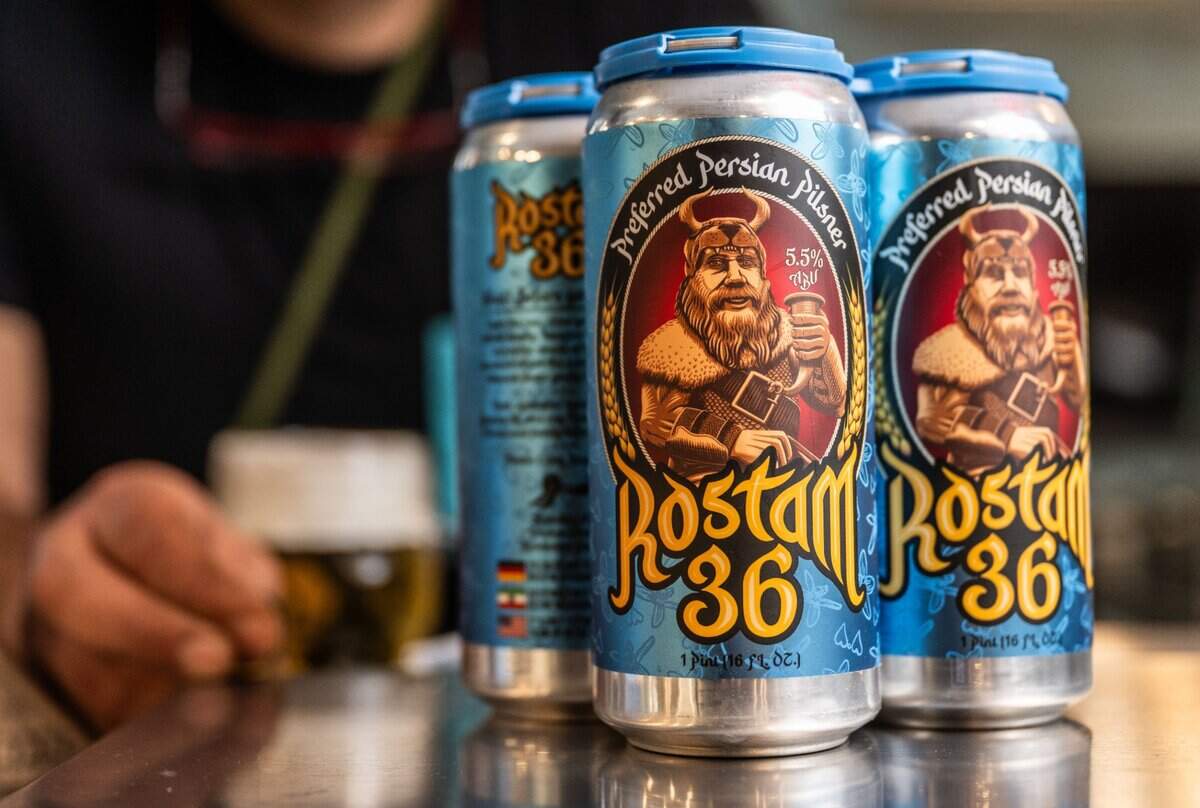 Cans of Rostam 36, a Persian beer made by Karan Khoshcar, on Friday, Jan. 3, 2024. The pilsner balances its hops’ bitterness with the addition of orange blossoms, a floral taste that frequently appears in Persian entrees and desserts.