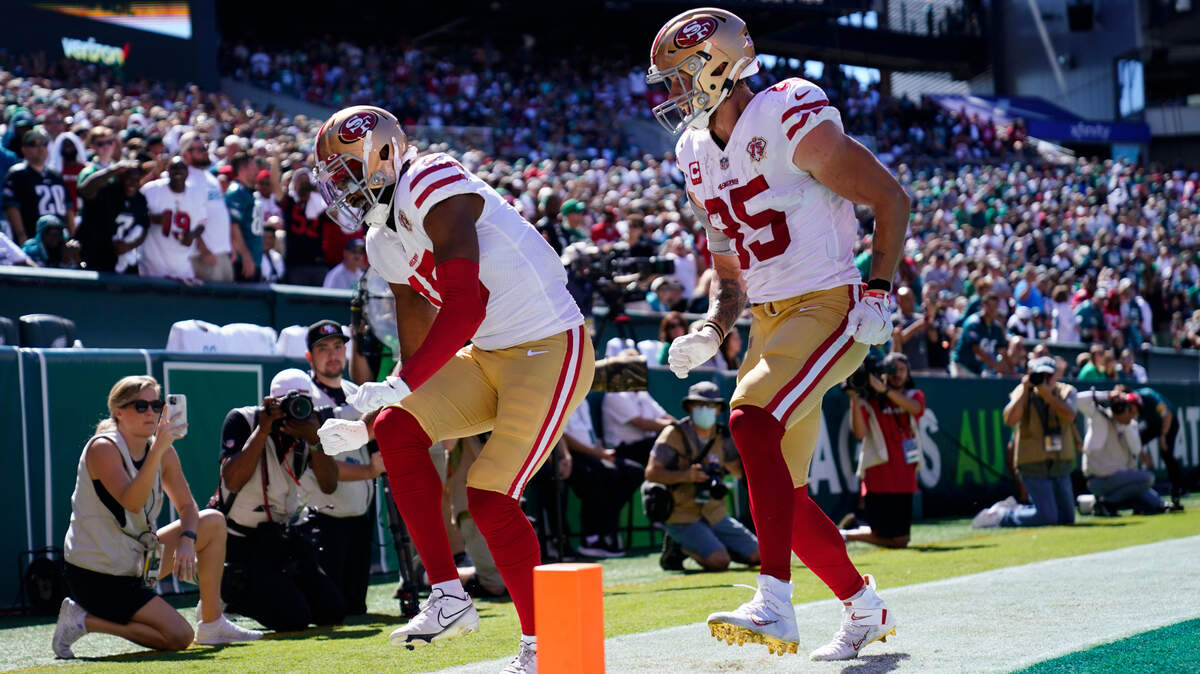 San Francisco 49ers wide receiver Jauan Jennings celebrates a touchdown at the end of the first half Sunday with teammate George Kittle.