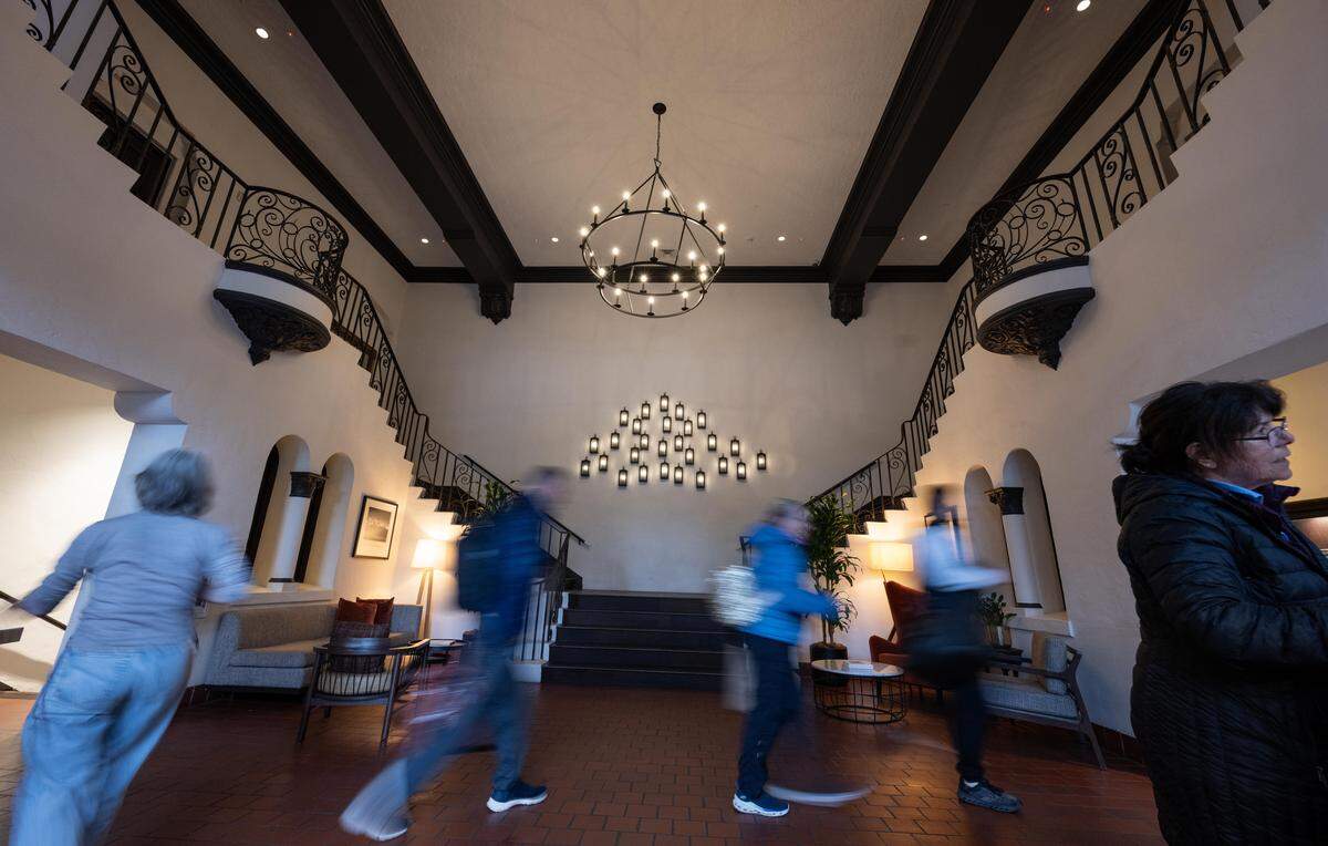 Guests cross the historic lobby of the Hyatt House hotel in midtown Sacramento on Wednesday. The conversion of the Eastern Star temple, built as the meeting place of a Masonic women's organization in the 1920s, added 128 rooms to the city's hotel room inventory in 2023. 