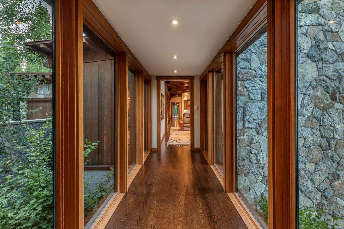 Striking glass hallways connect the two wings of the main house.