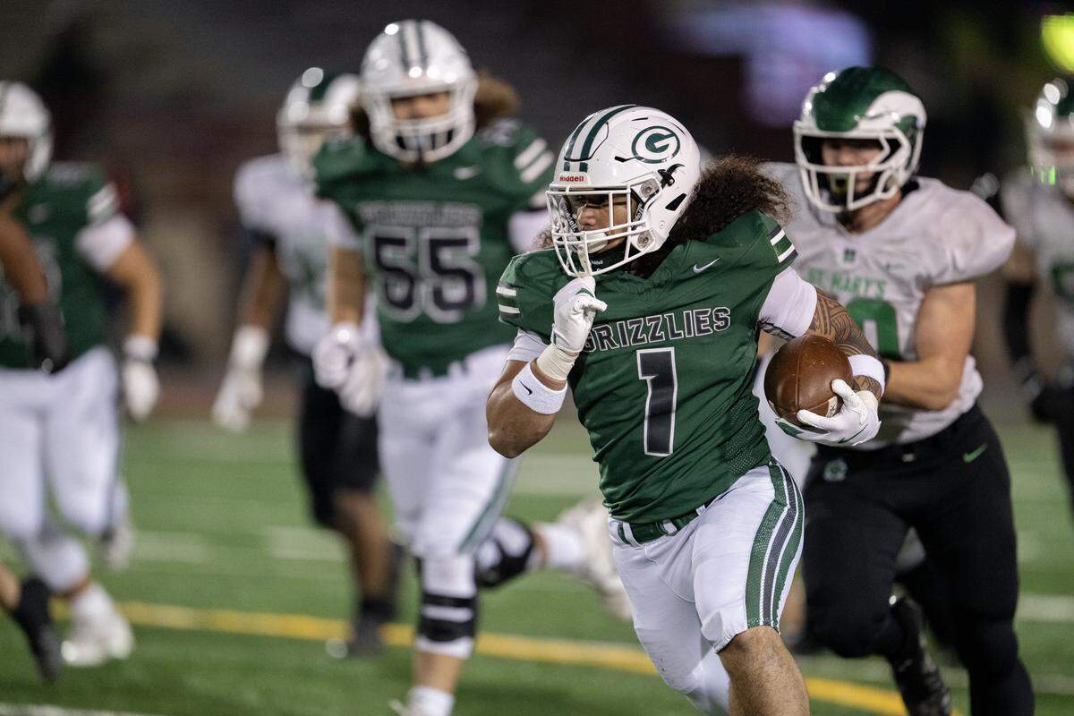 The Granite Bay Grizzlies' Isaiah Ene (1) runs in for the first Grizzlies touchdown in the first half against the St. Mary’s Rams in the CIF Sac-Joaquin Section Division II football championship Saturday at Hughes Stadium in Sacramento.