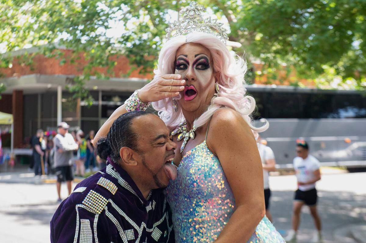 Sacramento Pride March and Parade grand marshals Clarmundo Sullivan, left, and DoMe Moore pose for a photo on Sunday, June 11, 2023, in Southside Park. “It means visibility, credibility and long overdue acceptance,” Sullivan said of being a grand marshal. “It’s important to see people of color in this community.”