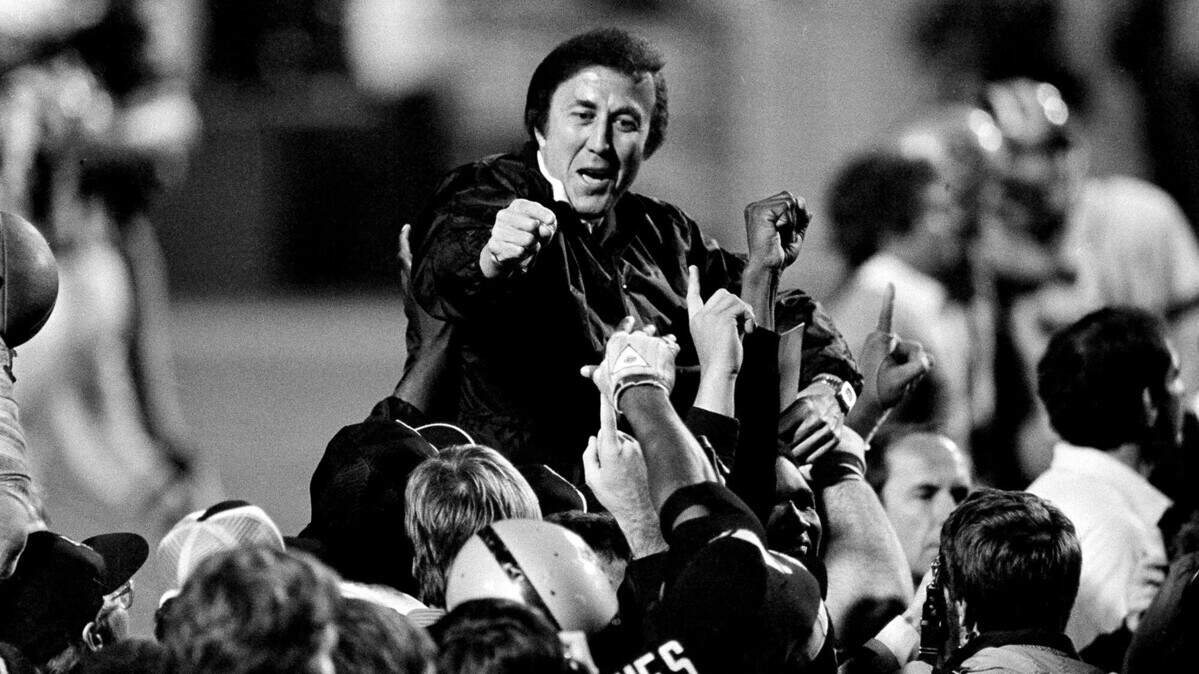 Los Angeles Raiders coach Tom Flores is carried off the field after a 38-9 victory over the Washington Redskins in Super Bowl XVIII in Tampa, Fla., on Jan. 23, 1984.