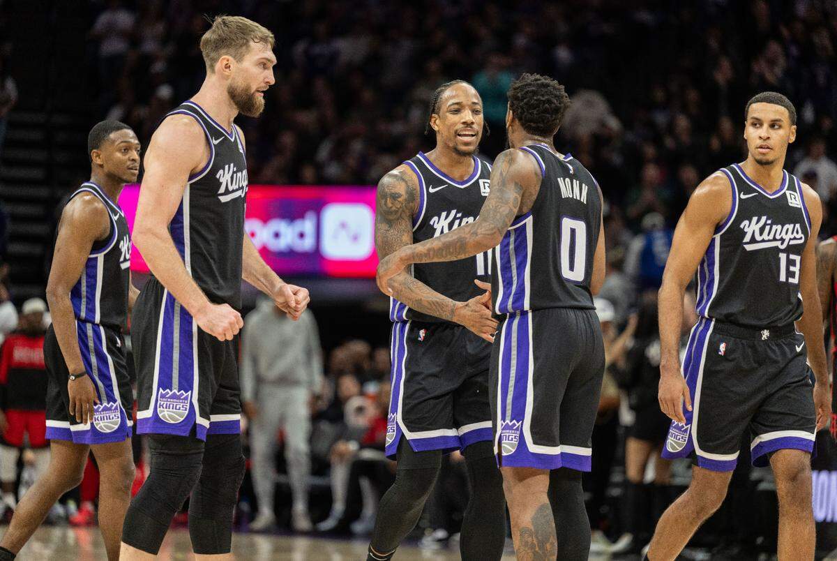 Sacramento Kings forward DeMar DeRozan (10) is celebrated after hitting a basket and getting fouled in the second half by teammate guard Malik Monk (0) during an NBA game on Thursday, Jan. 16, 2025 at Golden 1 Center.