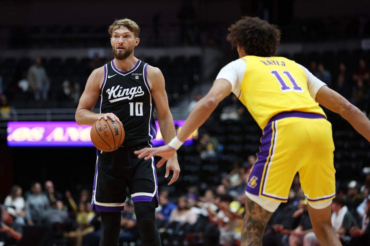 Sacramento Kings center Domantas Sabonis (10) dribbles during the first quarter against the Los Angeles Lakers on Wednesday, Oct. 11, 2023, at Honda Center in Anaheim.