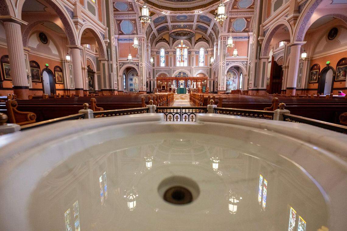 The baptismal bowl faces east from the entry of the church at the Cathedral of the Blessed Sacrament in downtown Sacramento. Once baptized, a new Catholic is welcomed by the church’s community.