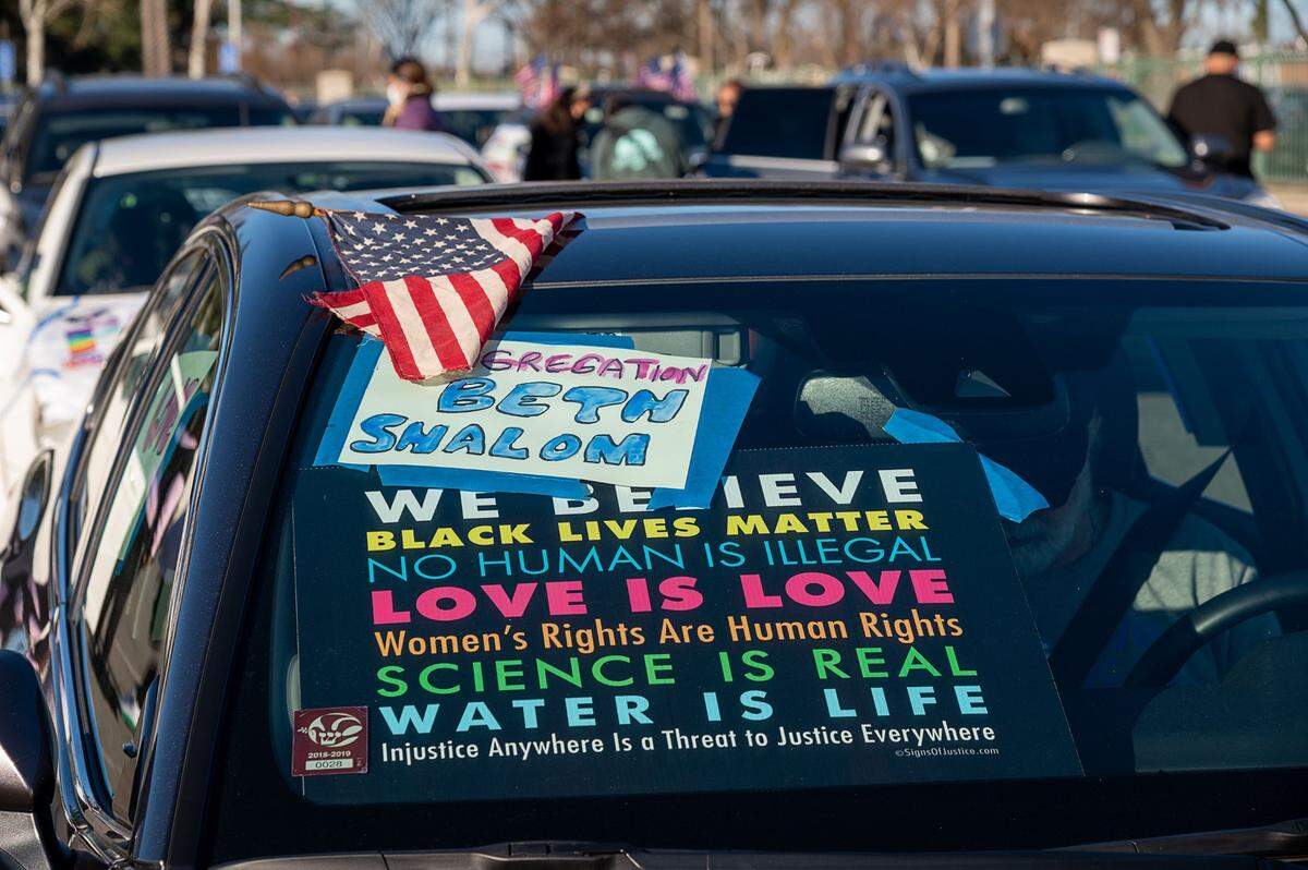 A car with a Congregation Beth Shalom sign participates in the #ReclaimMLK Day car caravan in celebration of Martin Luther King Jr. Day on Monday, Jan. 18, 2021 in Sacramento.