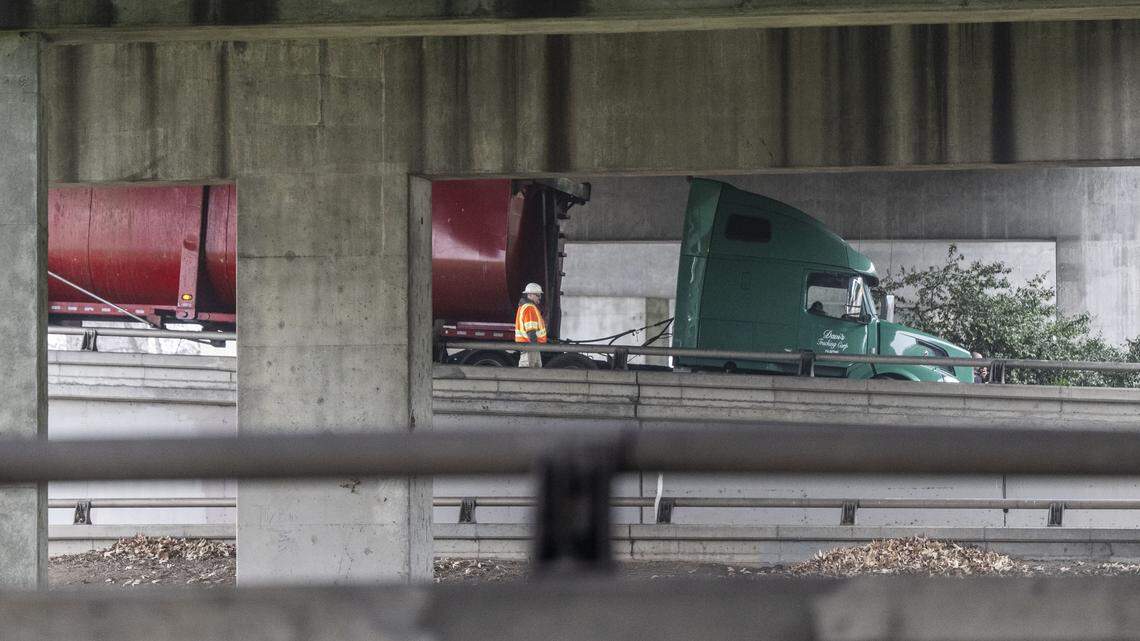 A tractor trailer that was involved in an accident is removed from the connector between eastbound Highway 50 and northbound Interstate 5 in Sacramento on Tuesday, Jan. 20, 2026.