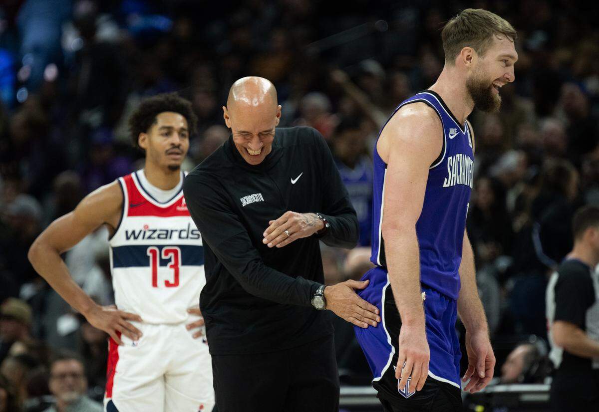 Sacramento Kings interim head coach Doug Christie celebrates with Sacramento Kings center Domantas Sabonis (11) after scoring during an NBA game agains the Washington Wizards at Golden 1 Center on Sunday, Jan. 19, 2025, in Sacramento.